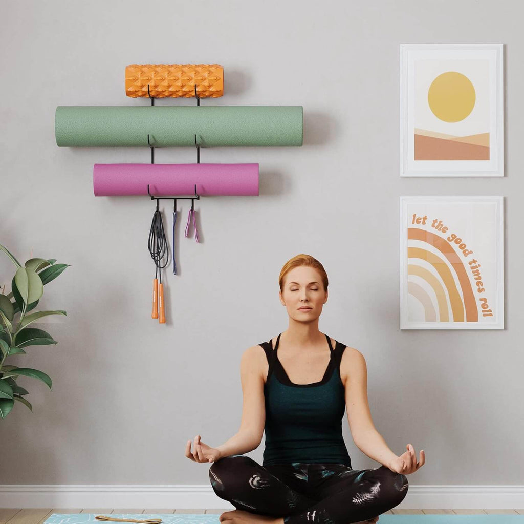 Medivita FlexRack Organizer holding fitness gear in a serene home gym setting with a woman meditating.